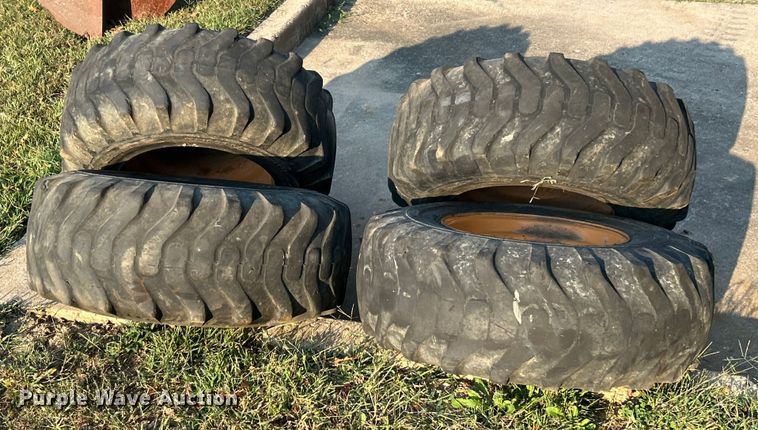 image for item ET3276 (4) 12-16.5L skid steer tires and wheels