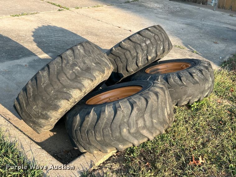 image for item ET3276 (4) 12-16.5L skid steer tires and wheels