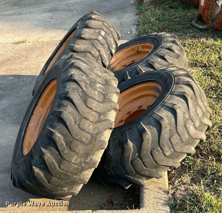 image for item ET3276 (4) 12-16.5L skid steer tires and wheels
