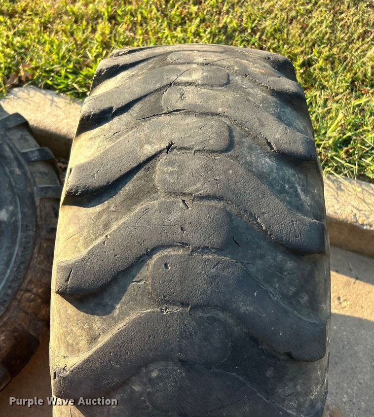 image for item ET3276 (4) 12-16.5L skid steer tires and wheels
