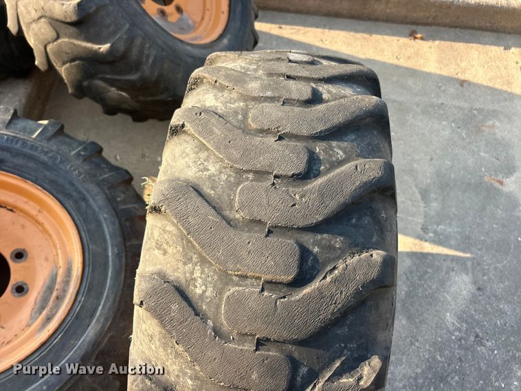 image for item ET3276 (4) 12-16.5L skid steer tires and wheels