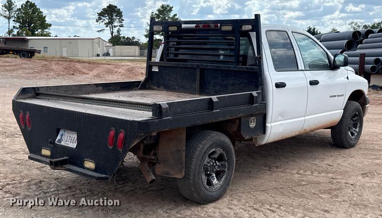 image for item EU5019 2002 Dodge Ram 1500 Quad Cab flatbed pickup truck