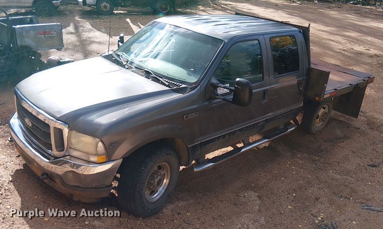 image for item EC1211 2003 Ford F250 Super Duty Crew Cab dump flatbed pickup truck