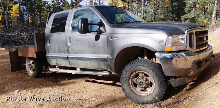 image for item EC1211 2003 Ford F250 Super Duty Crew Cab dump flatbed pickup truck