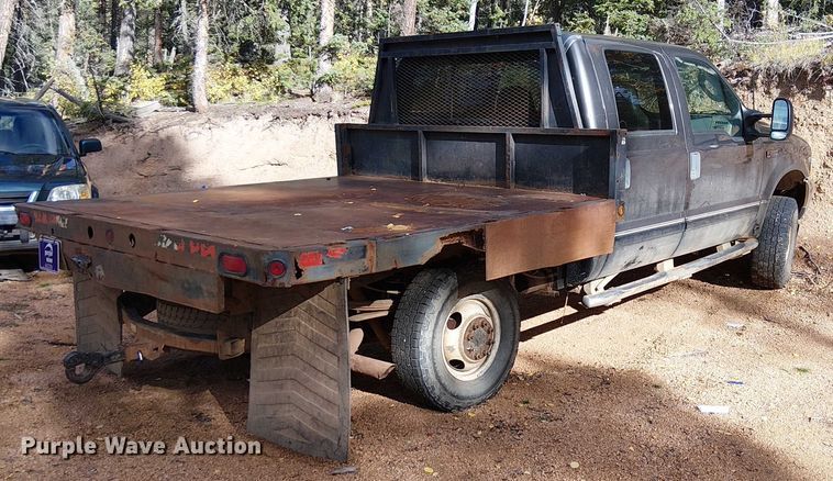 image for item EC1211 2003 Ford F250 Super Duty Crew Cab dump flatbed pickup truck