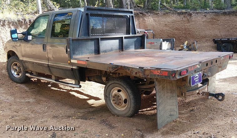 image for item EC1211 2003 Ford F250 Super Duty Crew Cab dump flatbed pickup truck