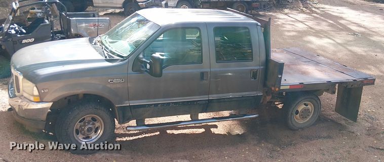 image for item EC1211 2003 Ford F250 Super Duty Crew Cab dump flatbed pickup truck