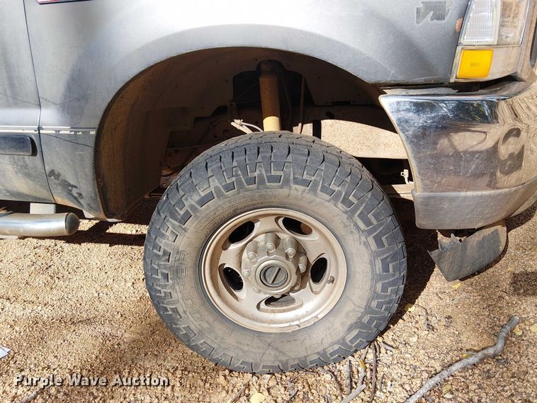 image for item EC1211 2003 Ford F250 Super Duty Crew Cab dump flatbed pickup truck