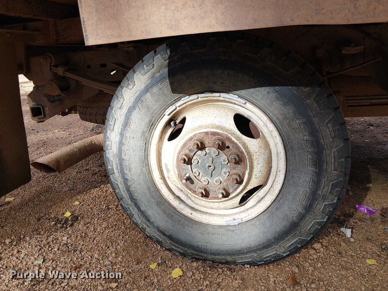 image for item EC1211 2003 Ford F250 Super Duty Crew Cab dump flatbed pickup truck