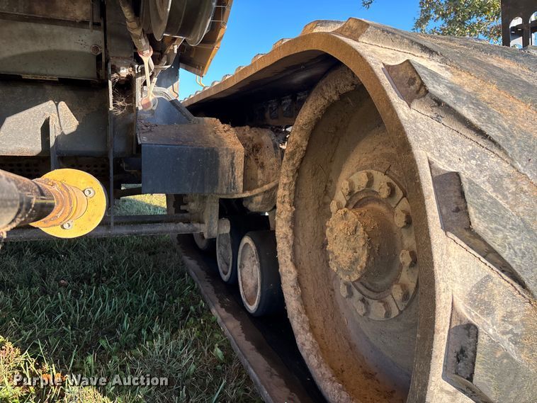 image for item ED2302 1999 Caterpillar Lexion 465 RWA combine