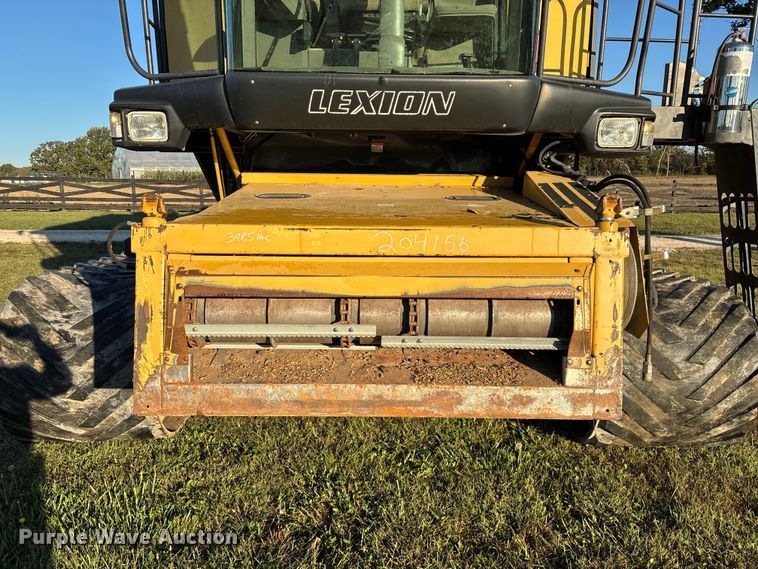 image for item ED2302 1999 Caterpillar Lexion 465 RWA combine