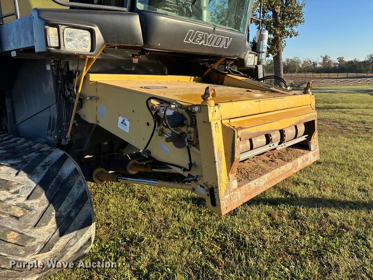 image for item ED2302 1999 Caterpillar Lexion 465 RWA combine