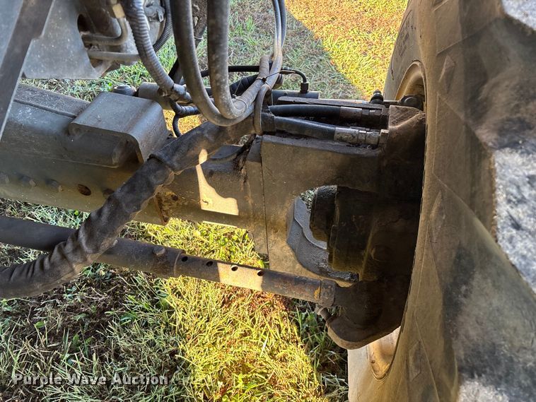 image for item ED2302 1999 Caterpillar Lexion 465 RWA combine