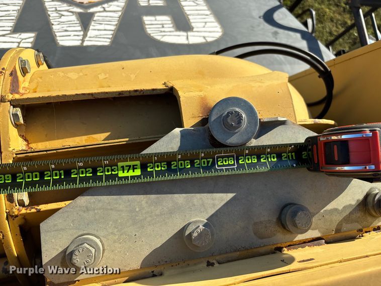 image for item ED2302 1999 Caterpillar Lexion 465 RWA combine