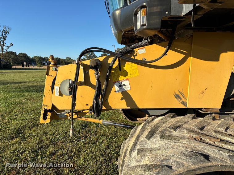 image for item ED2302 1999 Caterpillar Lexion 465 RWA combine