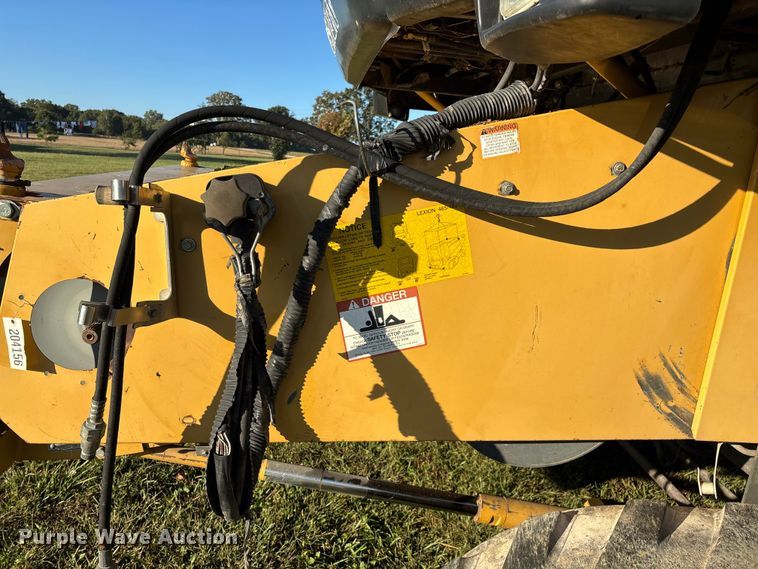 image for item ED2302 1999 Caterpillar Lexion 465 RWA combine
