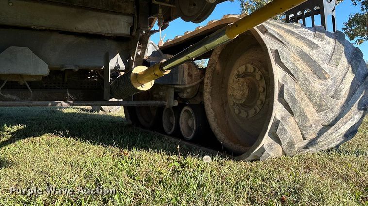 image for item ED2302 1999 Caterpillar Lexion 465 RWA combine