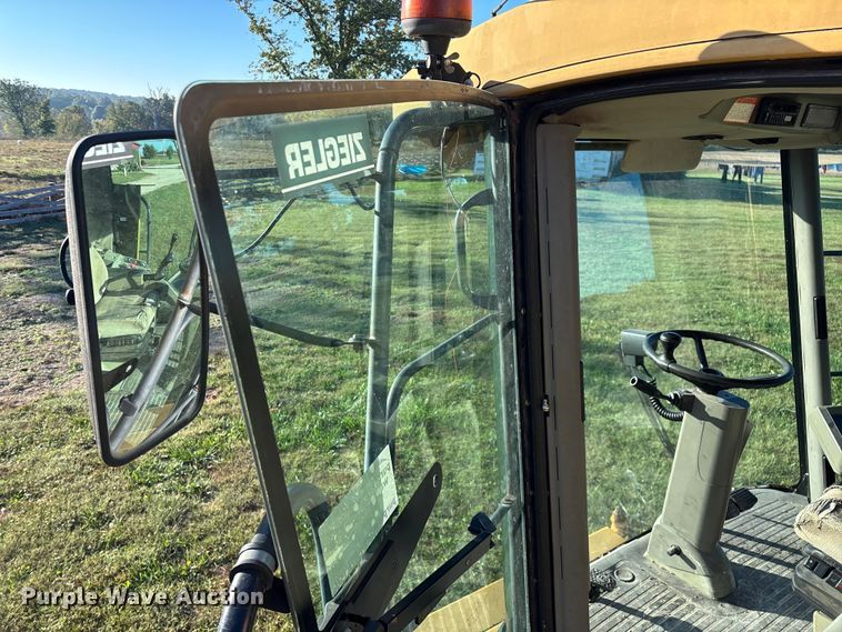 image for item ED2302 1999 Caterpillar Lexion 465 RWA combine