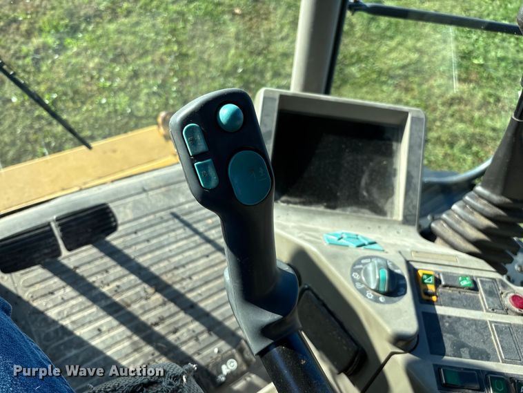 image for item ED2302 1999 Caterpillar Lexion 465 RWA combine