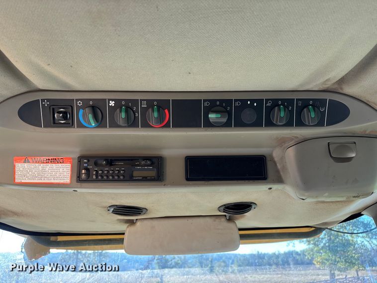 image for item ED2302 1999 Caterpillar Lexion 465 RWA combine