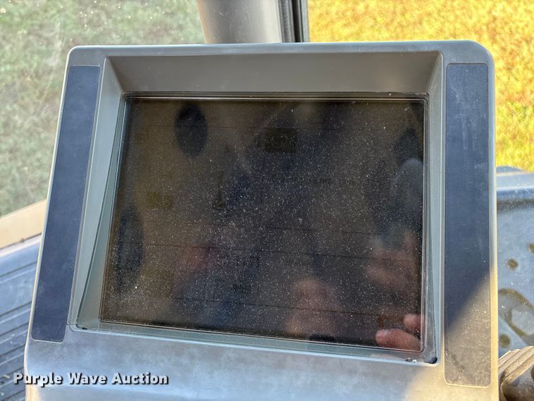 image for item ED2302 1999 Caterpillar Lexion 465 RWA combine