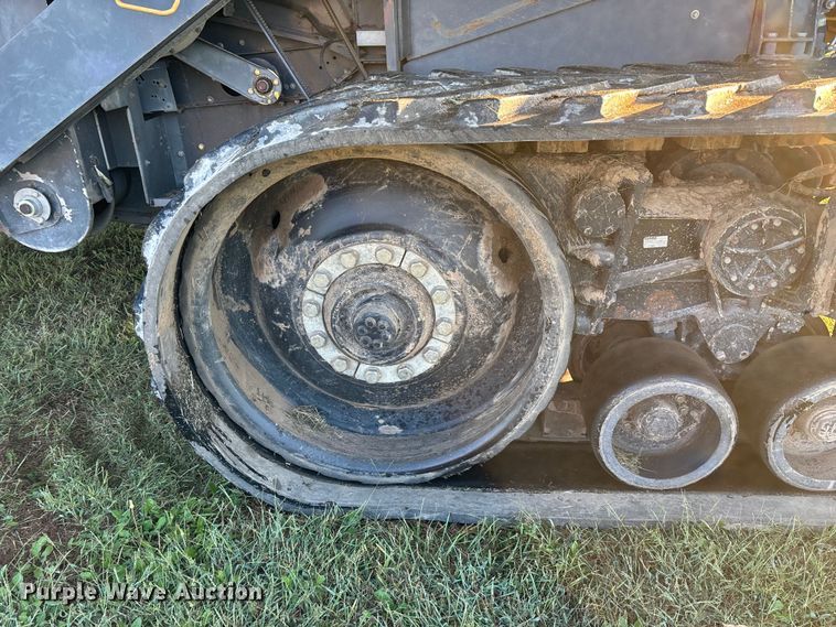 image for item ED2302 1999 Caterpillar Lexion 465 RWA combine