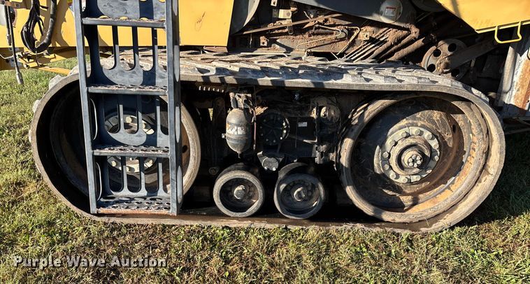 image for item ED2302 1999 Caterpillar Lexion 465 RWA combine