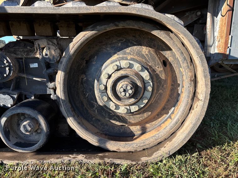 image for item ED2302 1999 Caterpillar Lexion 465 RWA combine