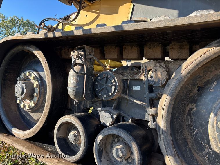 image for item ED2302 1999 Caterpillar Lexion 465 RWA combine