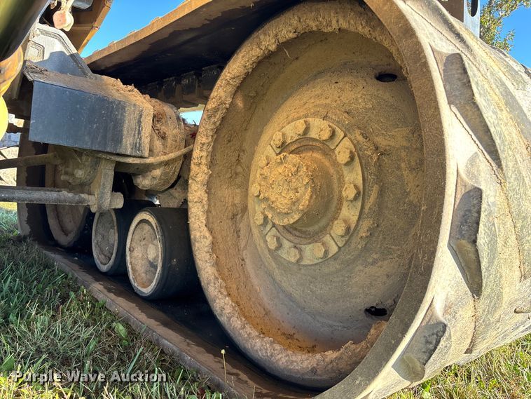 image for item ED2302 1999 Caterpillar Lexion 465 RWA combine