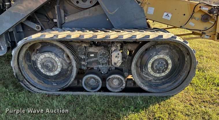 image for item ED2302 1999 Caterpillar Lexion 465 RWA combine