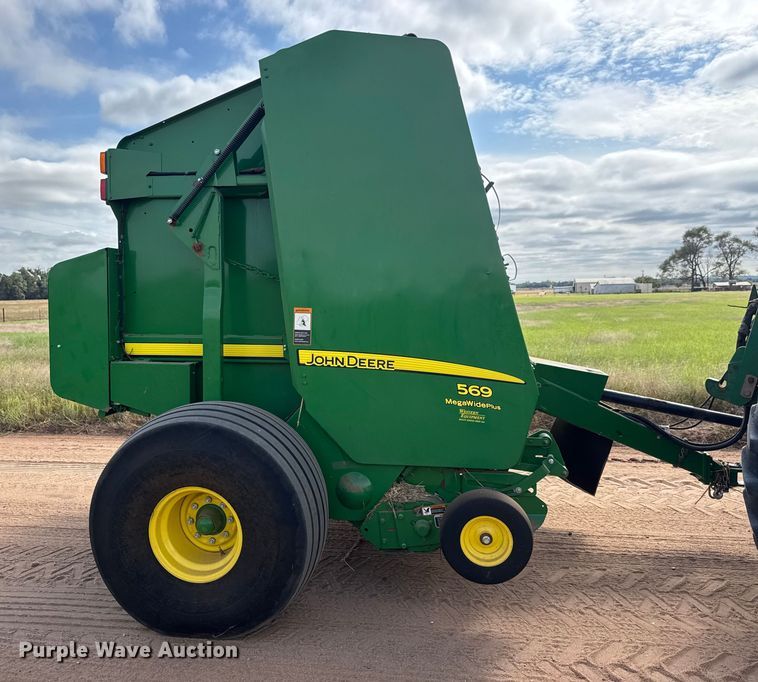 image for item EM8371 2015 John Deere 569 Mega Wide Plus round baler