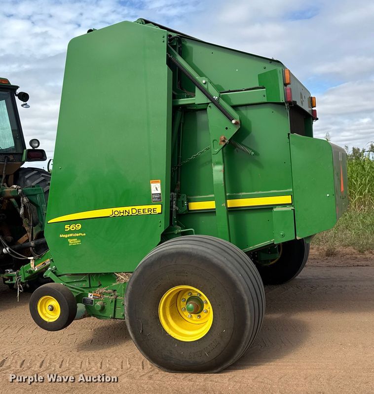 image for item EM8371 2015 John Deere 569 Mega Wide Plus round baler