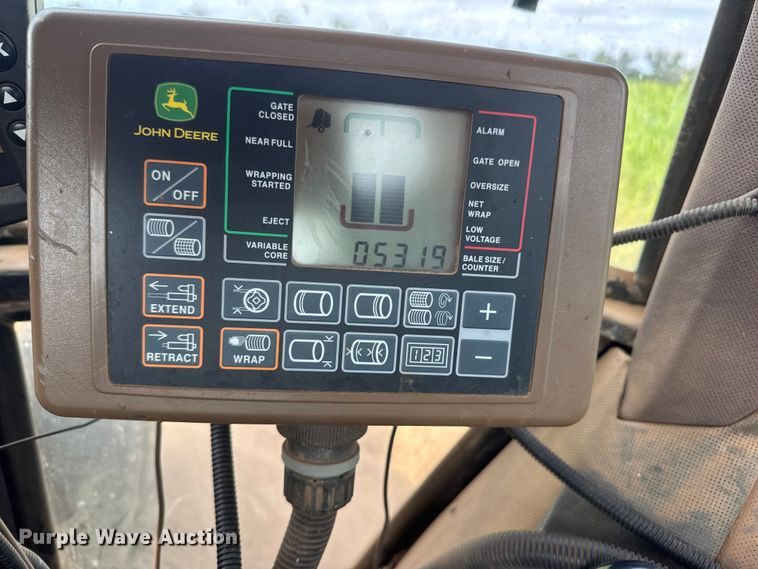 image for item EM8371 2015 John Deere 569 Mega Wide Plus round baler