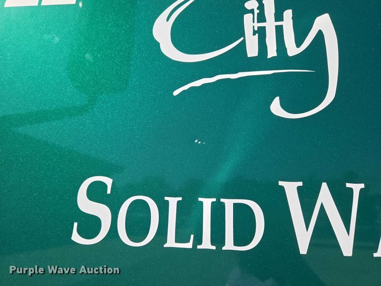 image for item EU5143 2016 Caterpillar CF7AA roll-off container truck