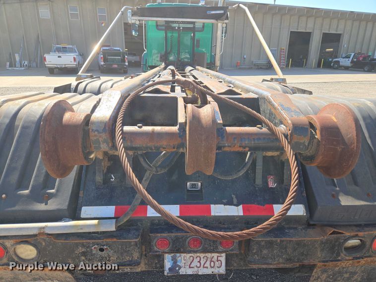 image for item EU5143 2016 Caterpillar CF7AA roll-off container truck