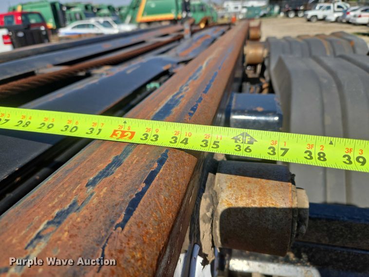 image for item EU5143 2016 Caterpillar CF7AA roll-off container truck