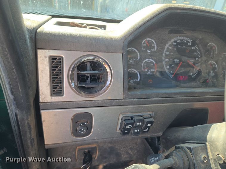 image for item EU5143 2016 Caterpillar CF7AA roll-off container truck