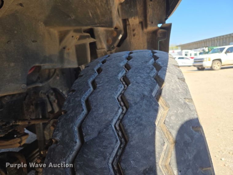 image for item EU5143 2016 Caterpillar CF7AA roll-off container truck