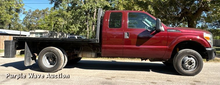 image for item EA6989 2012 Ford F350 Super Duty SuperCab flatbed pickup truck