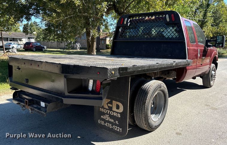 image for item EA6989 2012 Ford F350 Super Duty SuperCab flatbed pickup truck