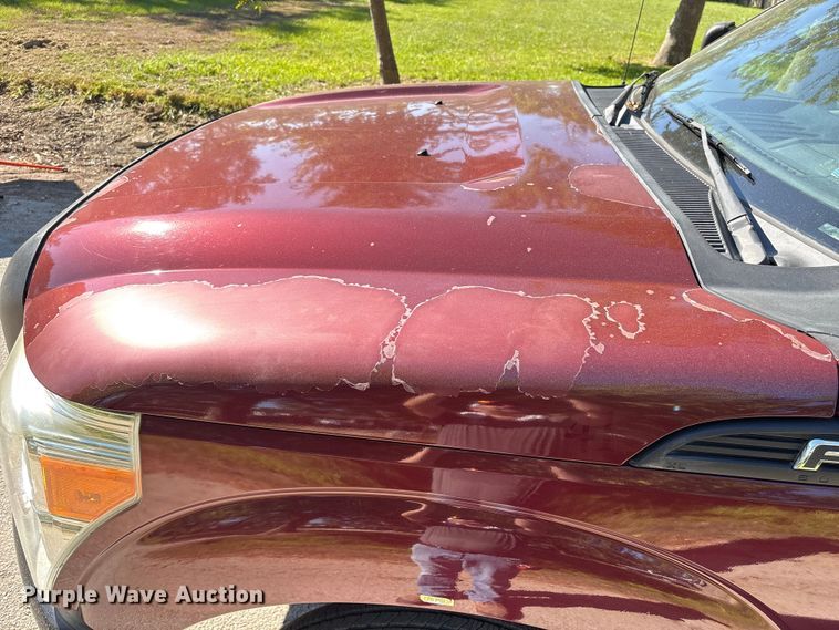 image for item EA6989 2012 Ford F350 Super Duty SuperCab flatbed pickup truck