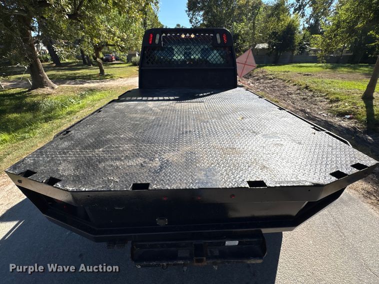 image for item EA6989 2012 Ford F350 Super Duty SuperCab flatbed pickup truck