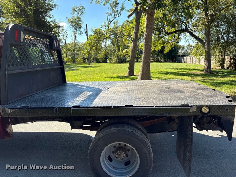 image for item EA6989 2012 Ford F350 Super Duty SuperCab flatbed pickup truck