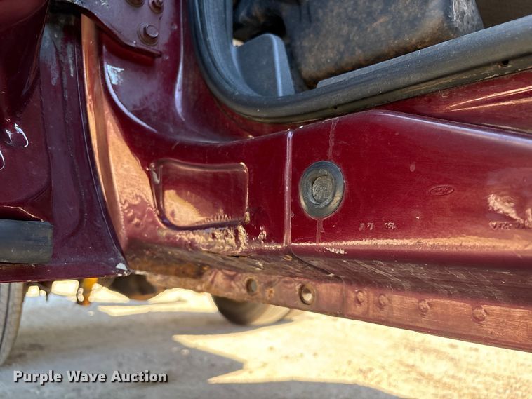 image for item EA6989 2012 Ford F350 Super Duty SuperCab flatbed pickup truck