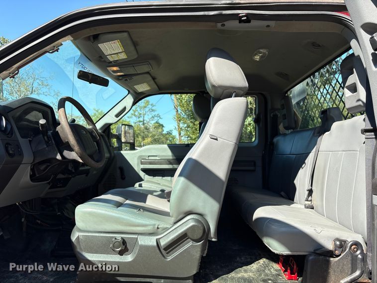 image for item EA6989 2012 Ford F350 Super Duty SuperCab flatbed pickup truck