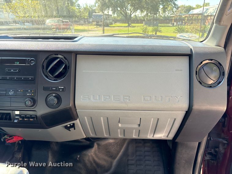 image for item EA6989 2012 Ford F350 Super Duty SuperCab flatbed pickup truck