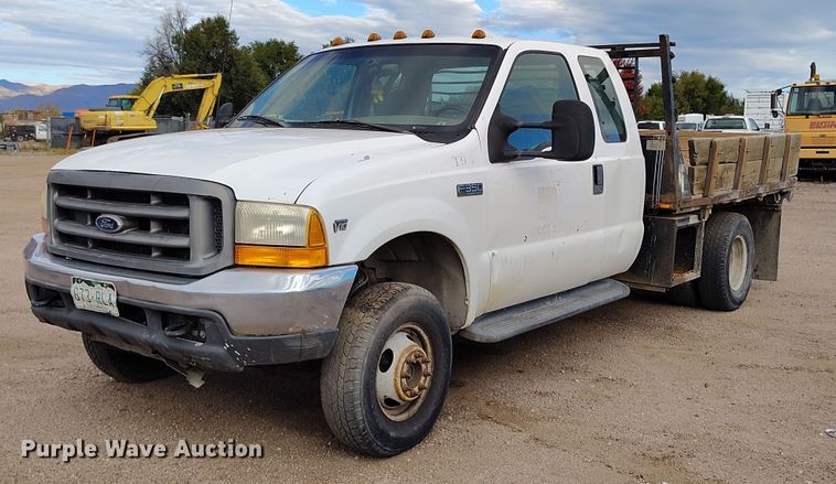 image for item IP9720 2000 Ford F350 Super Duty SuperCab dump flatbed pickup truck