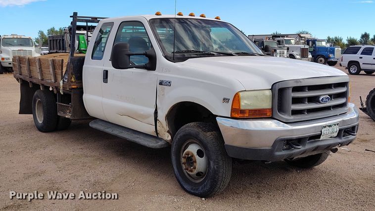 image for item IP9720 2000 Ford F350 Super Duty SuperCab dump flatbed pickup truck