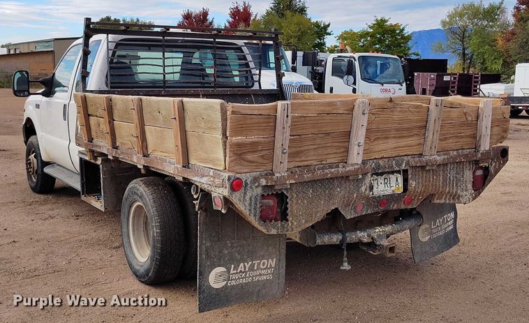 image for item IP9720 2000 Ford F350 Super Duty SuperCab dump flatbed pickup truck